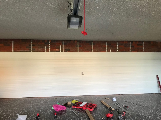 StoreWALL Brite White Panels on Brick Wall
