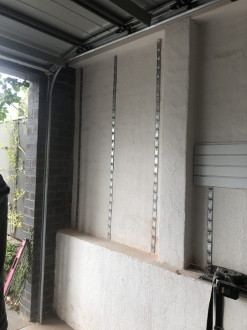 Installstrips on a Brick Wall