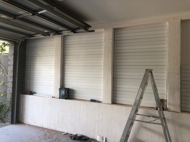 Garage Wall Panels on a Brick Wall