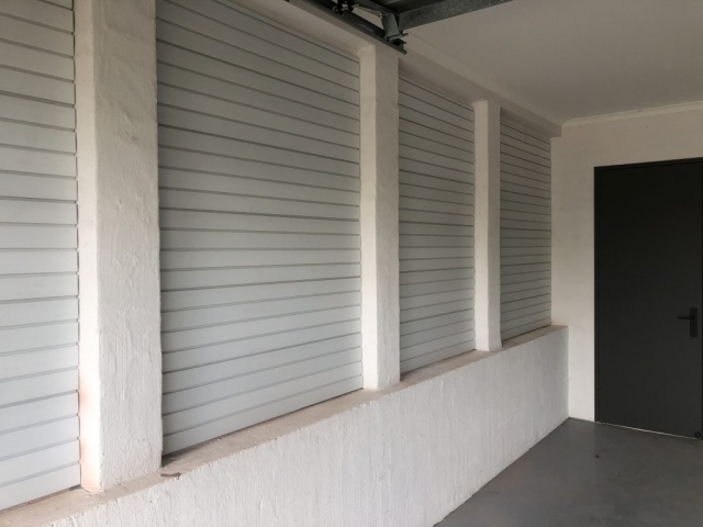Wall Panels on a Brick Wall