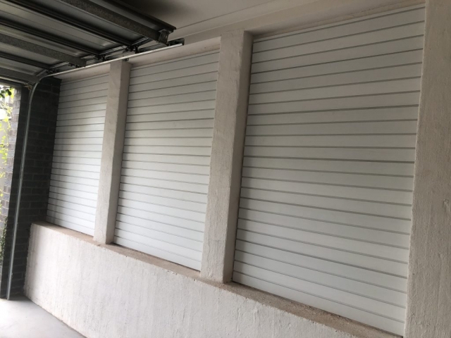 Brite White panels on a Brick Wall