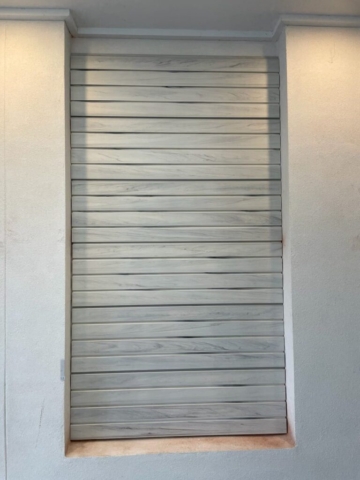 Whitewood Wall Panel Installation on a Rendered Brick Wall
