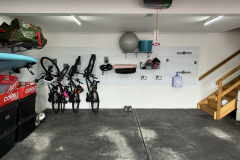 Multiple bicycles stored vertically using StoreWALL Rotating Bike Hooks mounts on StoreWALL slatwall panels