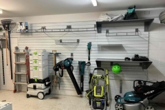 Garage wall storage shelving on brite white slatwall