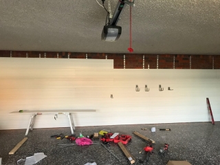 Slatwall on a brick garage wall