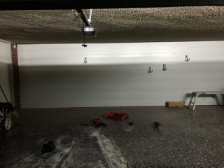 Slatwall on a brick garage wall
