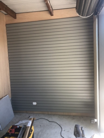 Slatwall garage wall panels on marine board